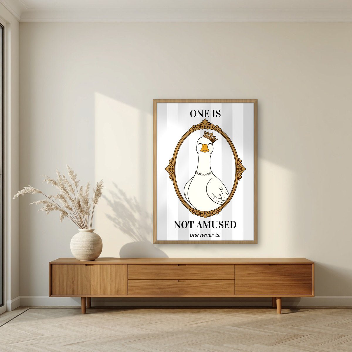 One Is Not Amused – Palace Grey art print, in an oak frame, styled in a living room