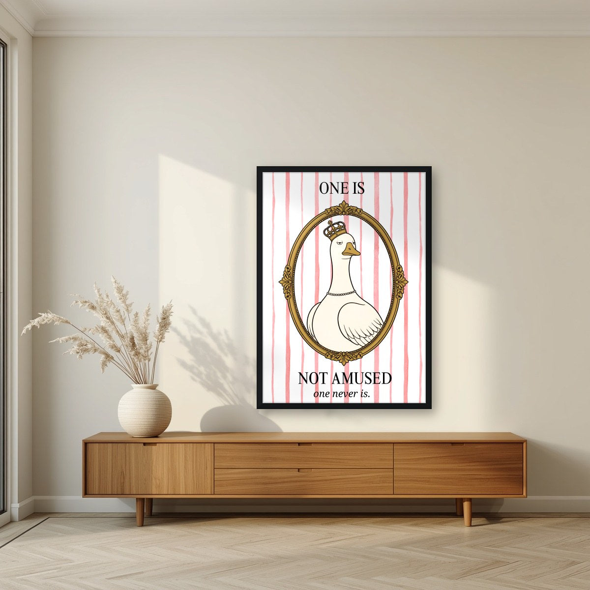 One Is Not Amused – Rosewater Stripe art print, in a black frame, styled in a living room