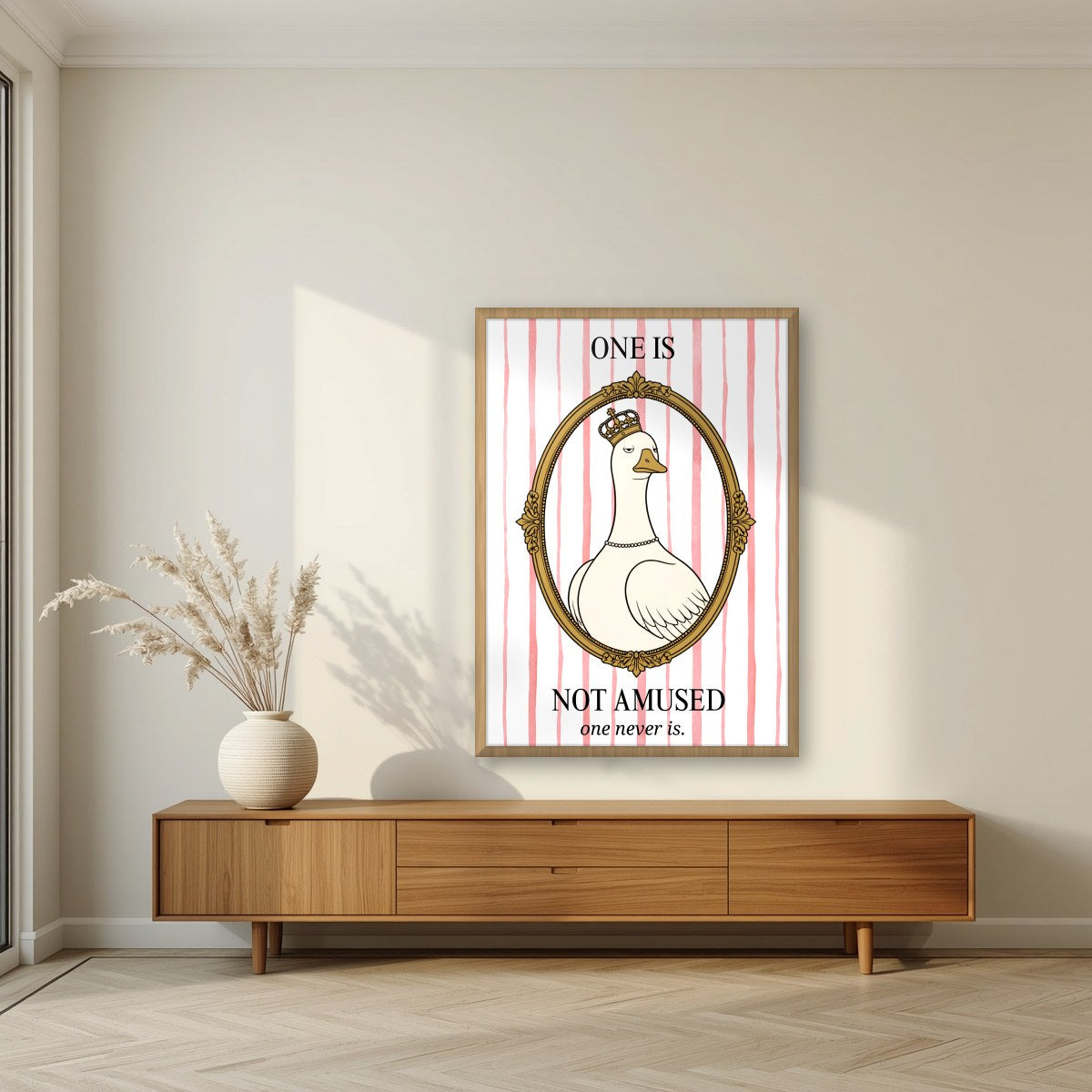 One Is Not Amused – Rosewater Stripe art print, in an oak frame, styled in a living room