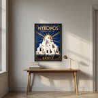 Panagia Paraportiani — Mykonos art print, in a black frame, styled in a desk