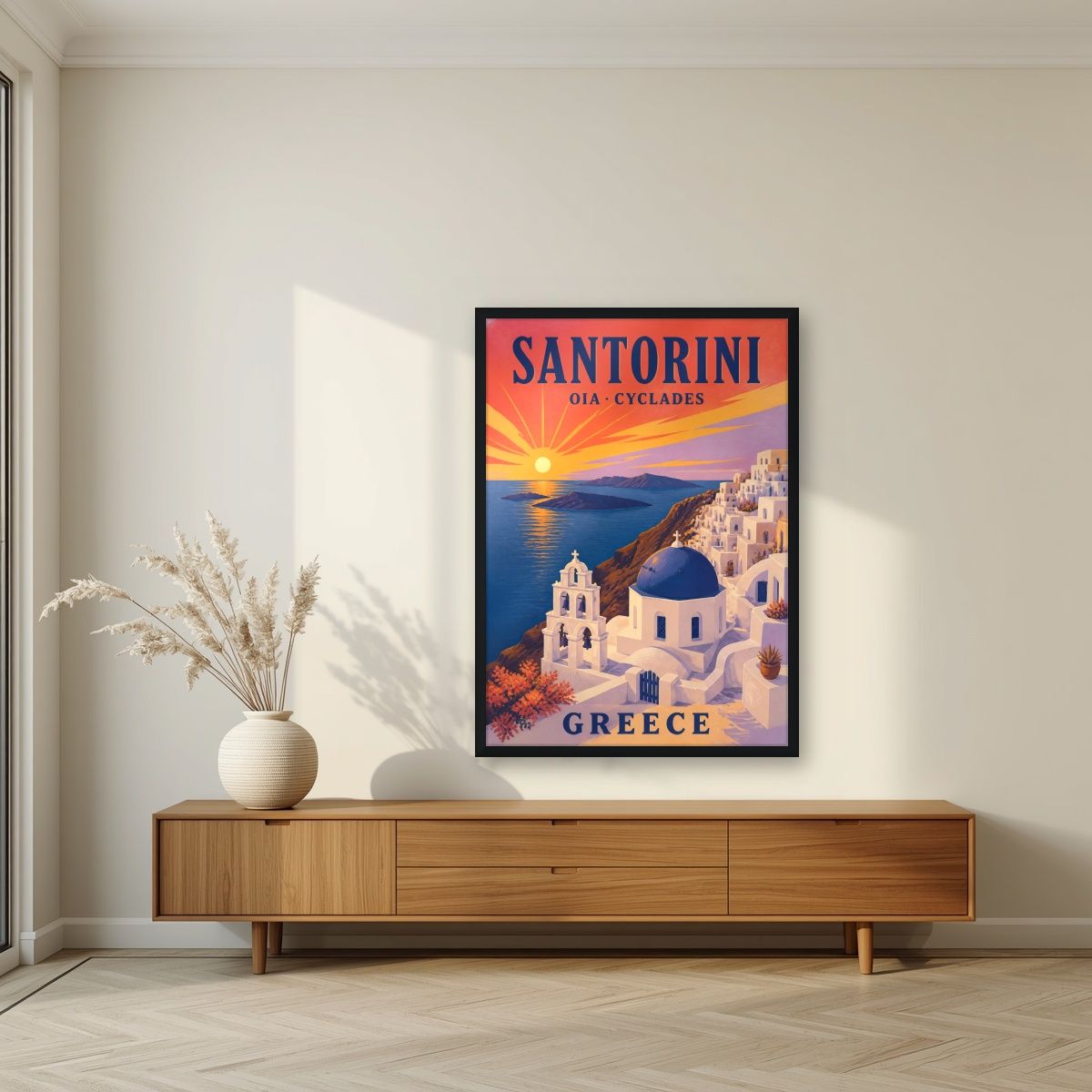 Iliovasilema — Santorini art print, in a black frame, styled in a living room