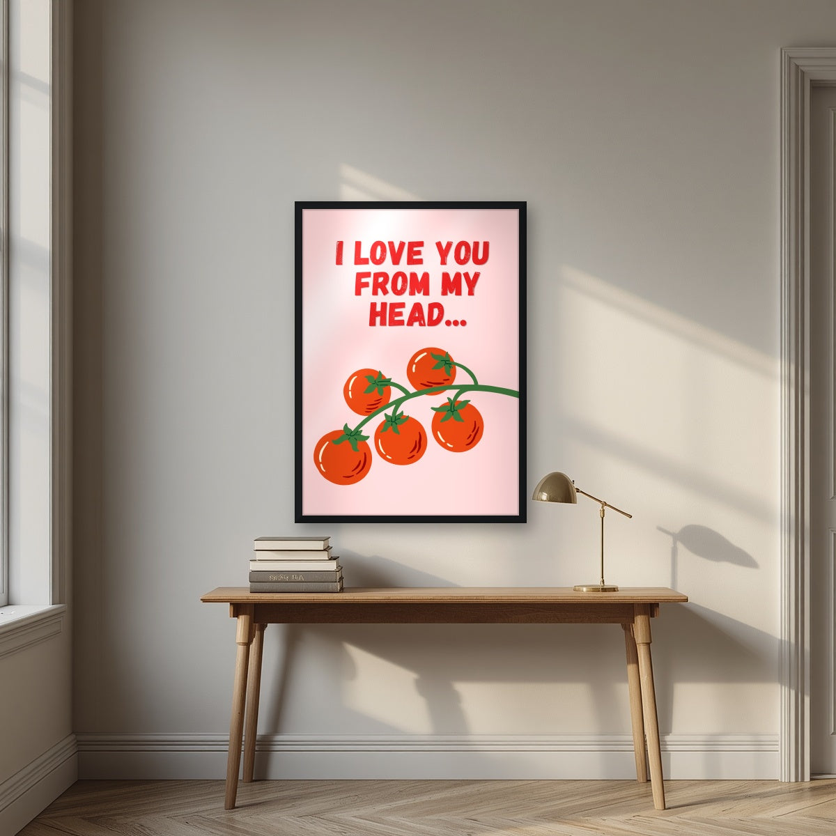 Head To-Matoes – Powder Blush print in a black frame above a desk