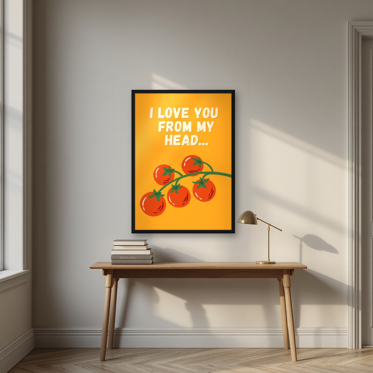 Head To-Matoes – Sunset Orange print in a black frame above a desk