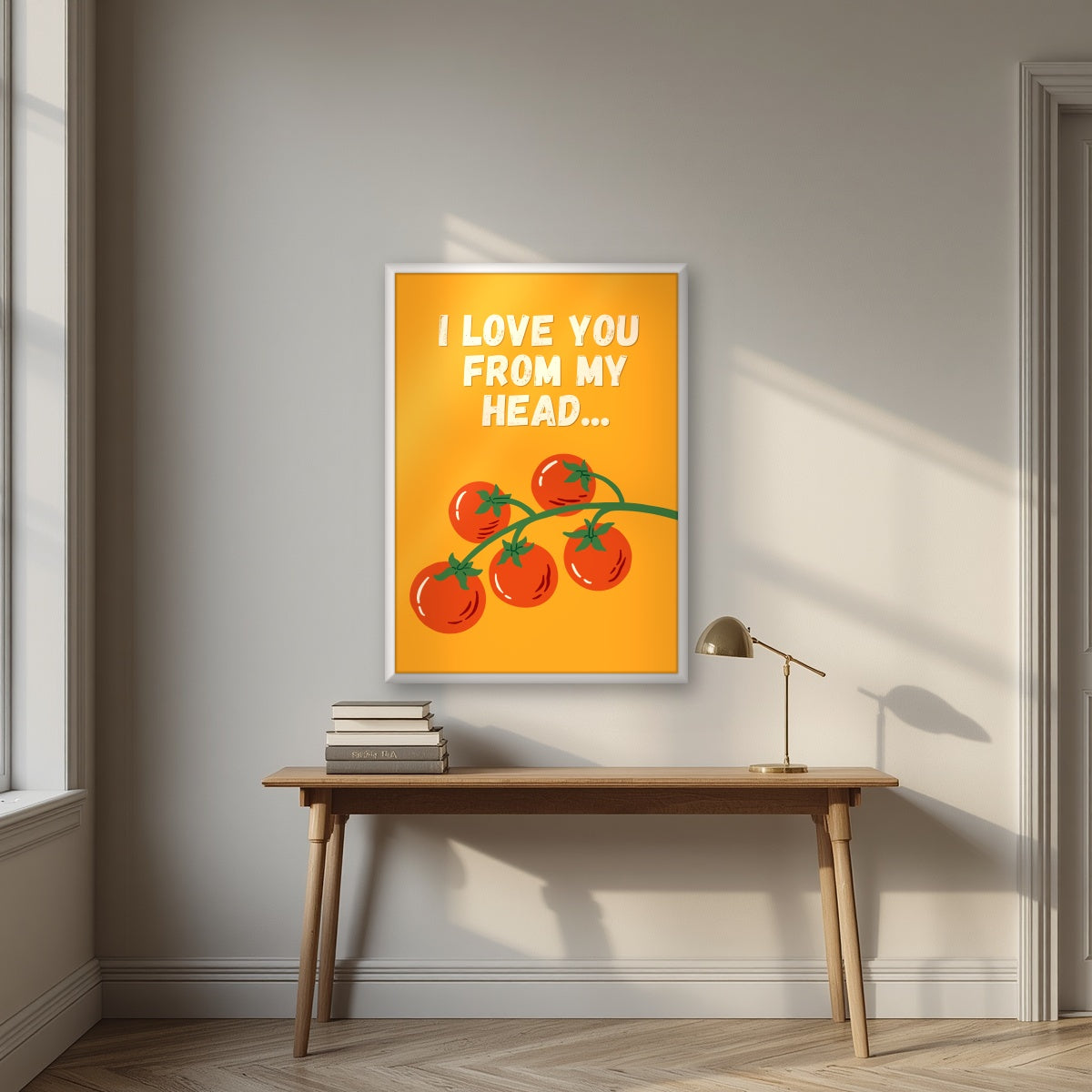 Head To-Matoes – Sunset Orange print in a white frame above a desk
