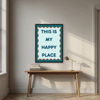 This Is My Happy Place – Deep Teal art print, in a black frame, styled in a desk