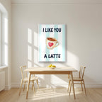 I Like You a Latte – Amalfi Aqua in a white frame, above a dining table in a bright kitchen