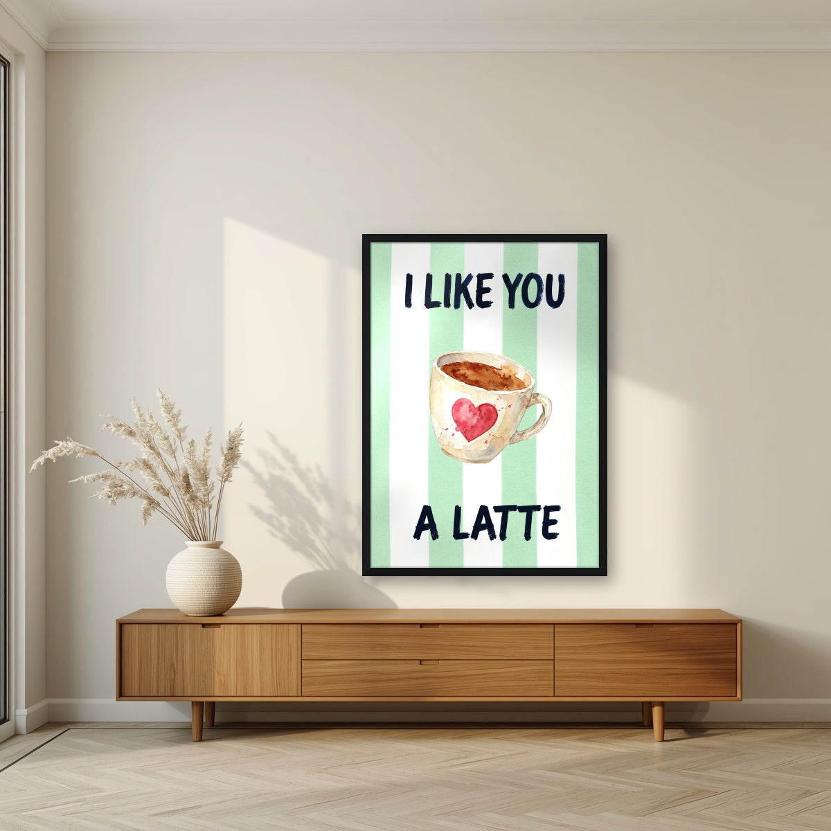 I Like You a Latte – Cabana Green in a black frame, above a walnut sideboard in a living room