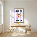 I Like You a Latte – Capri Violet in an oak frame, above a dining table in a bright kitchen