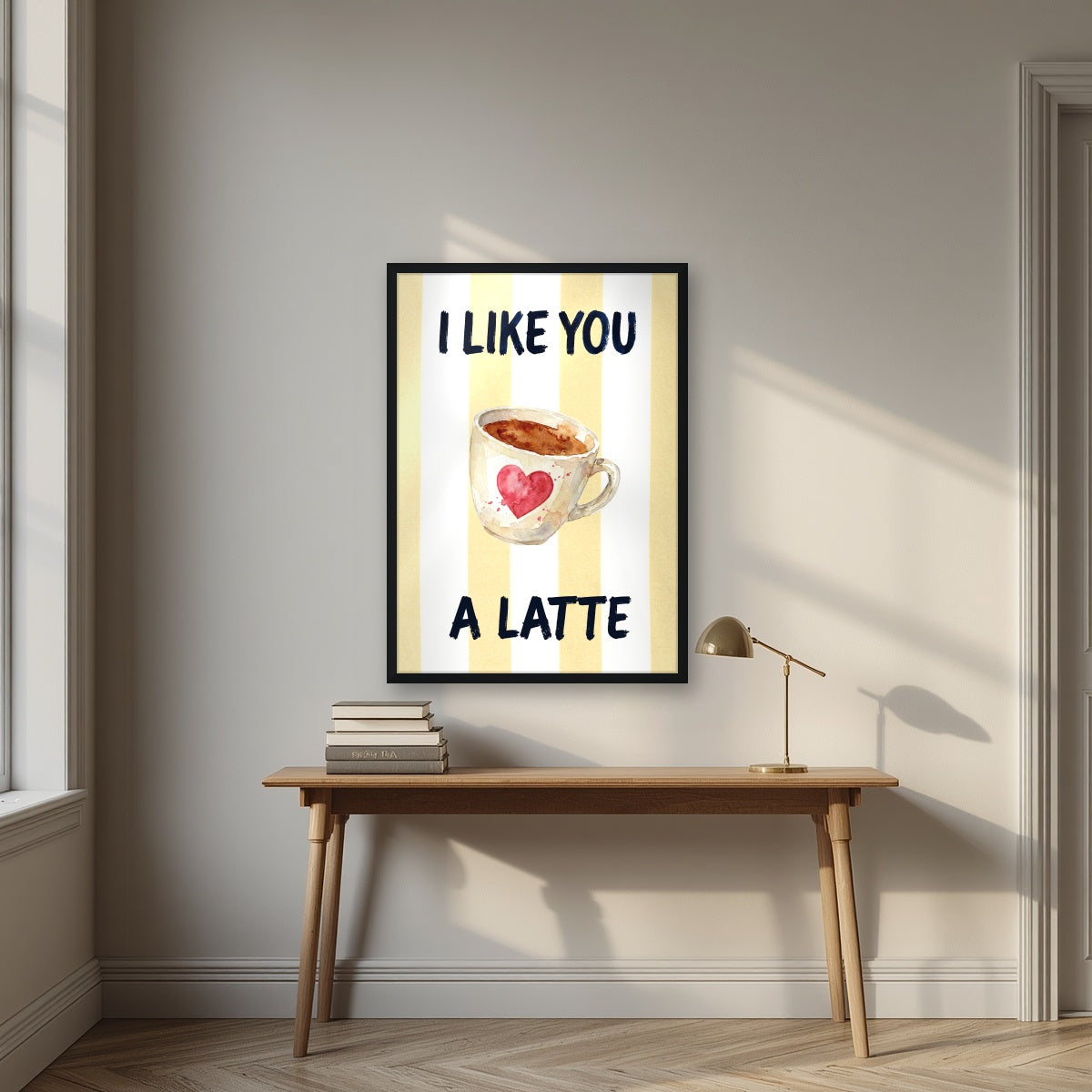 I Like You a Latte – Limoncello in a black frame, above an oak writing desk