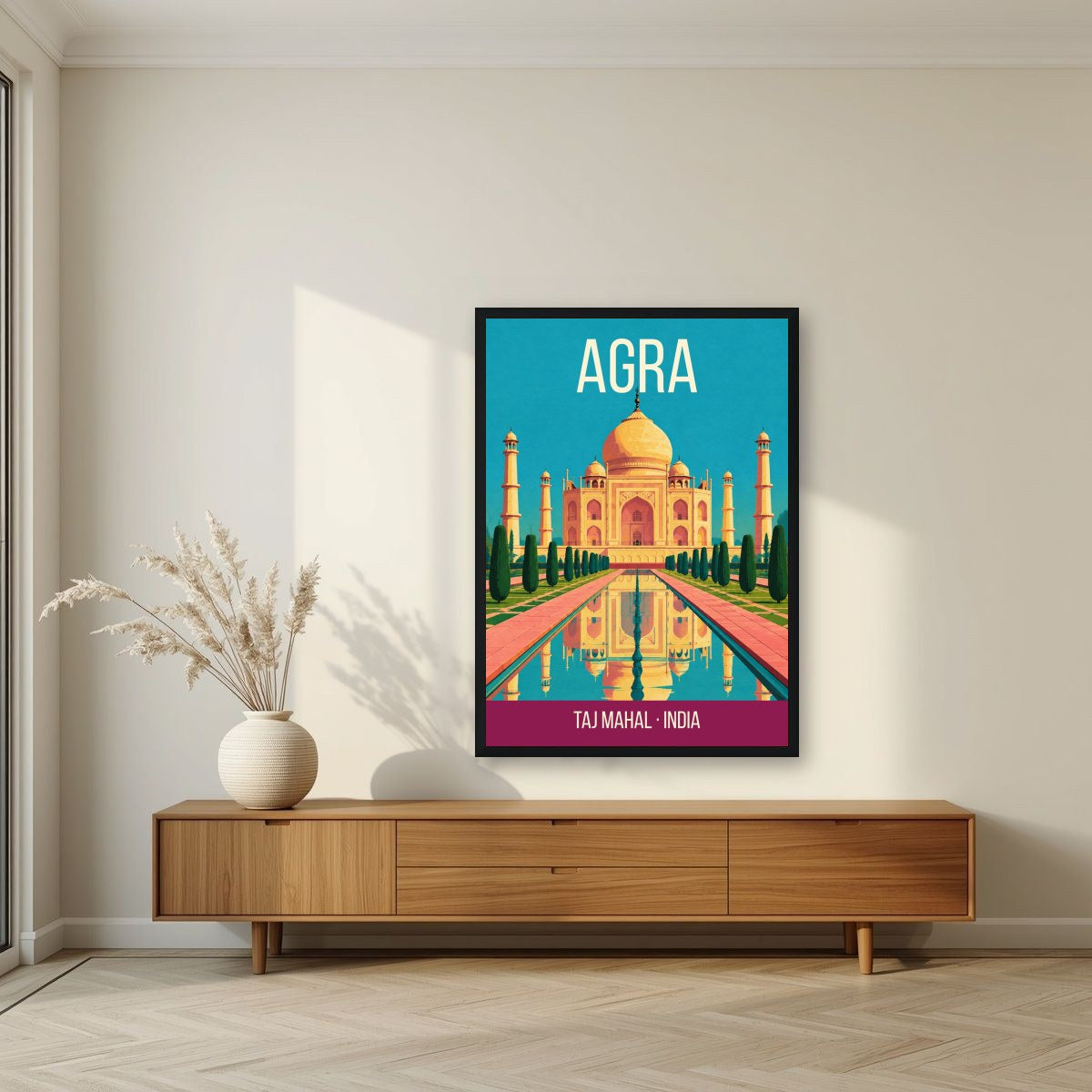 Taj Mahal Agra art print in a black frame above a living room sideboard