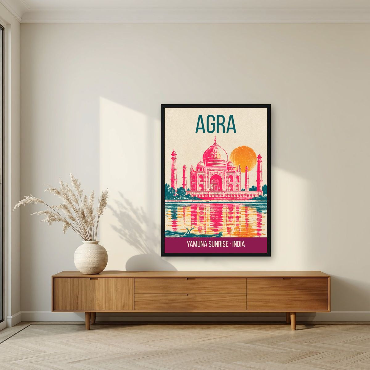 Yamuna Sunrise Agra art print in a black frame above a living room sideboard