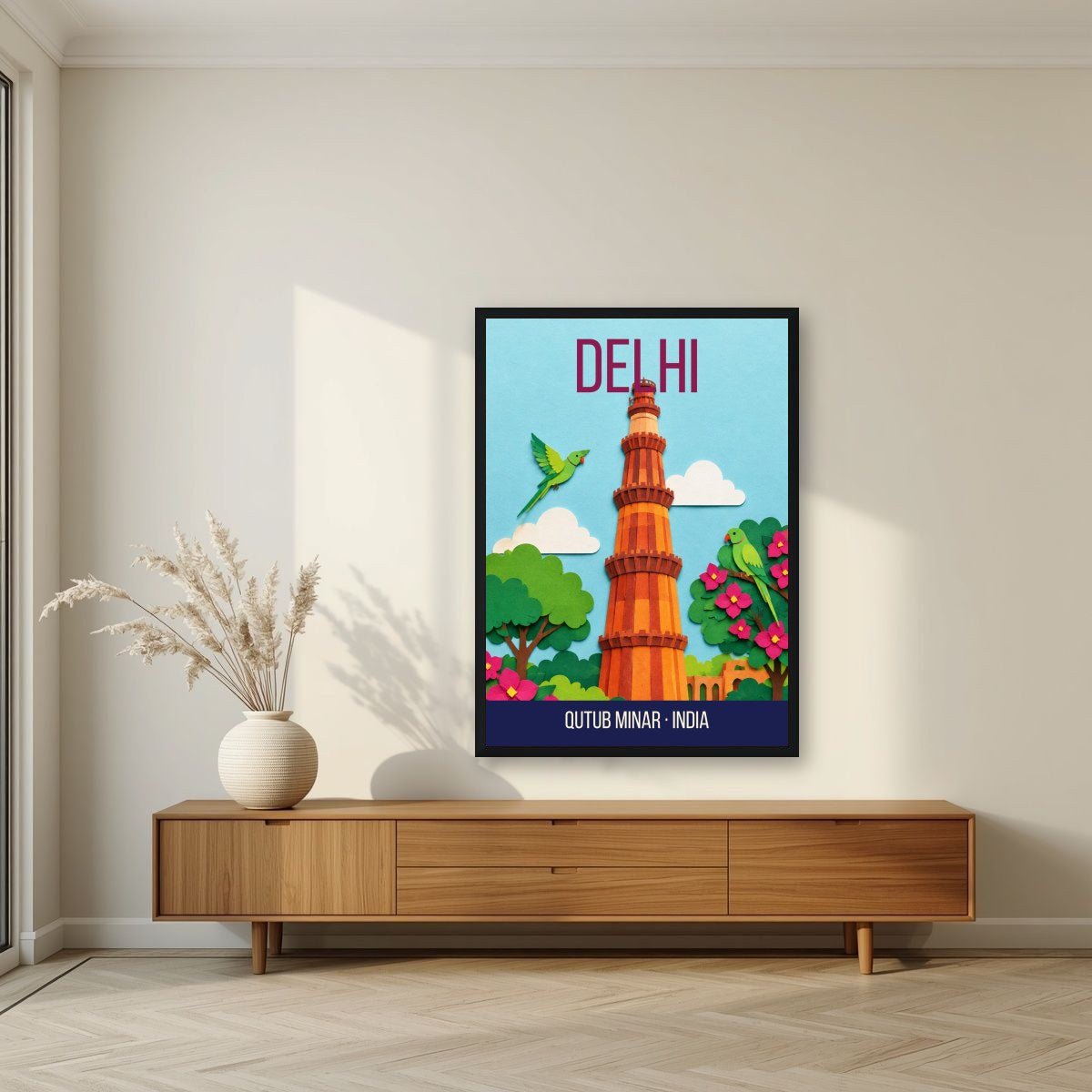 Qutub Minar Delhi art print in a black frame above a living room sideboard
