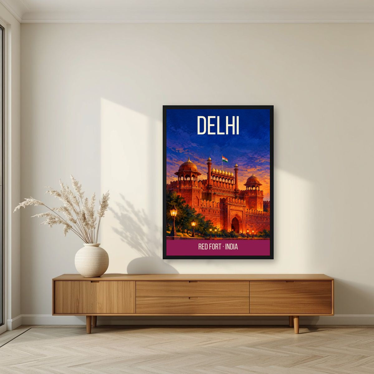 Red Fort Delhi art print in a black frame above a living room sideboard