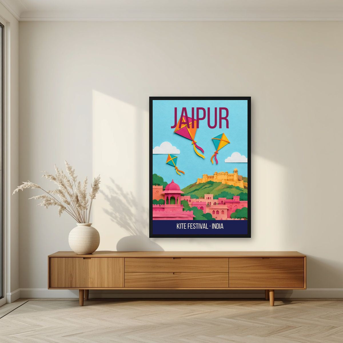 Kite Festival Jaipur art print in a black frame above a living room sideboard