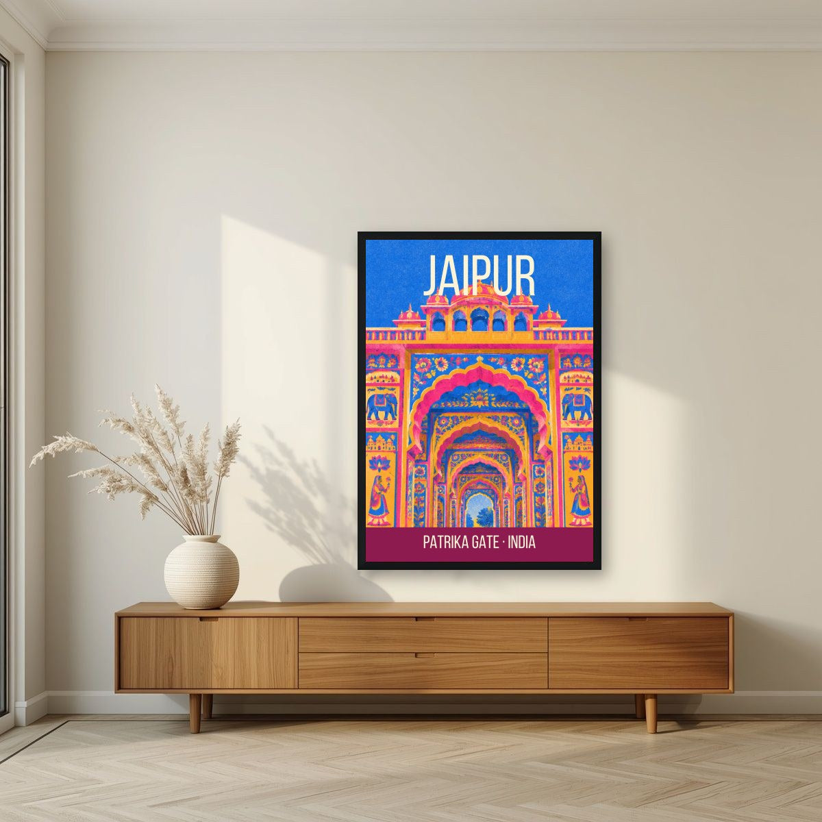 Patrika Gate Jaipur art print in a black frame above a living room sideboard
