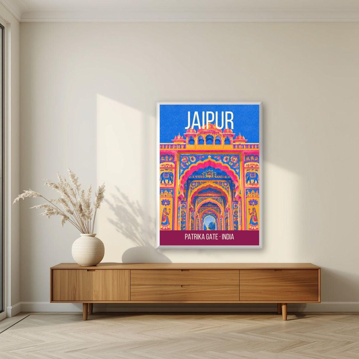 Patrika Gate Jaipur art print in a white frame on a living room wall