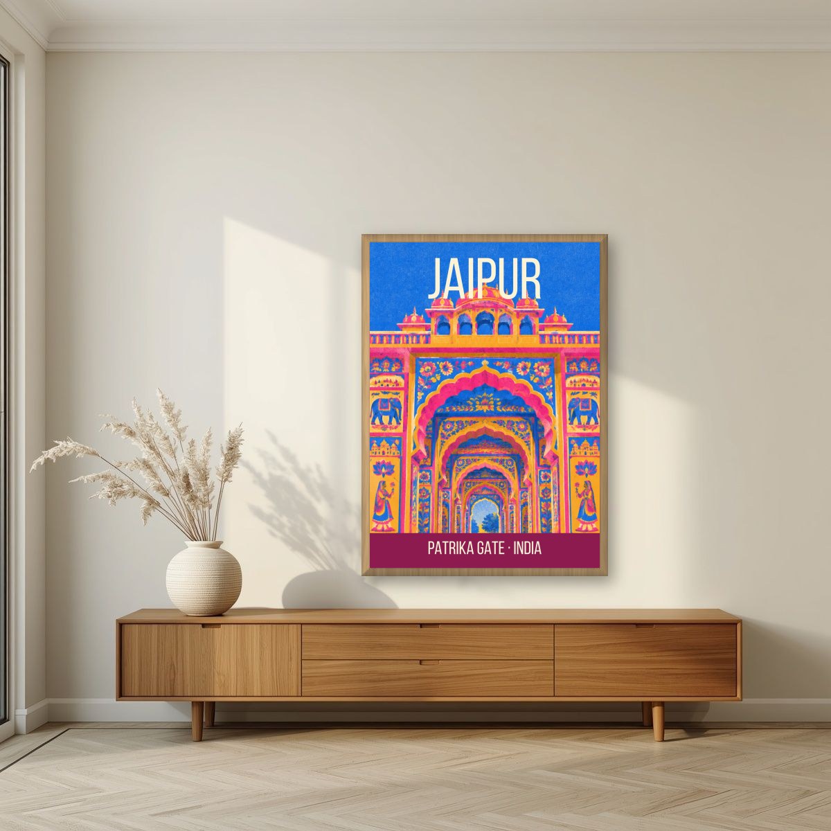 Patrika Gate Jaipur art print in an oak frame on a living room wall