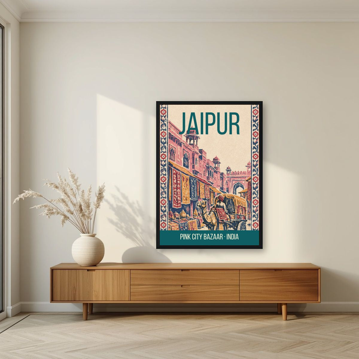 Pink City Bazaar Jaipur art print in a black frame above a living room sideboard