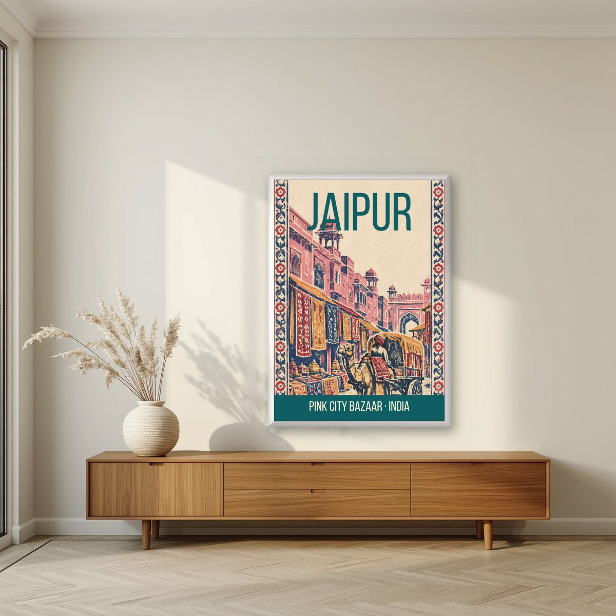 Pink City Bazaar Jaipur art print in a white frame on a living room wall