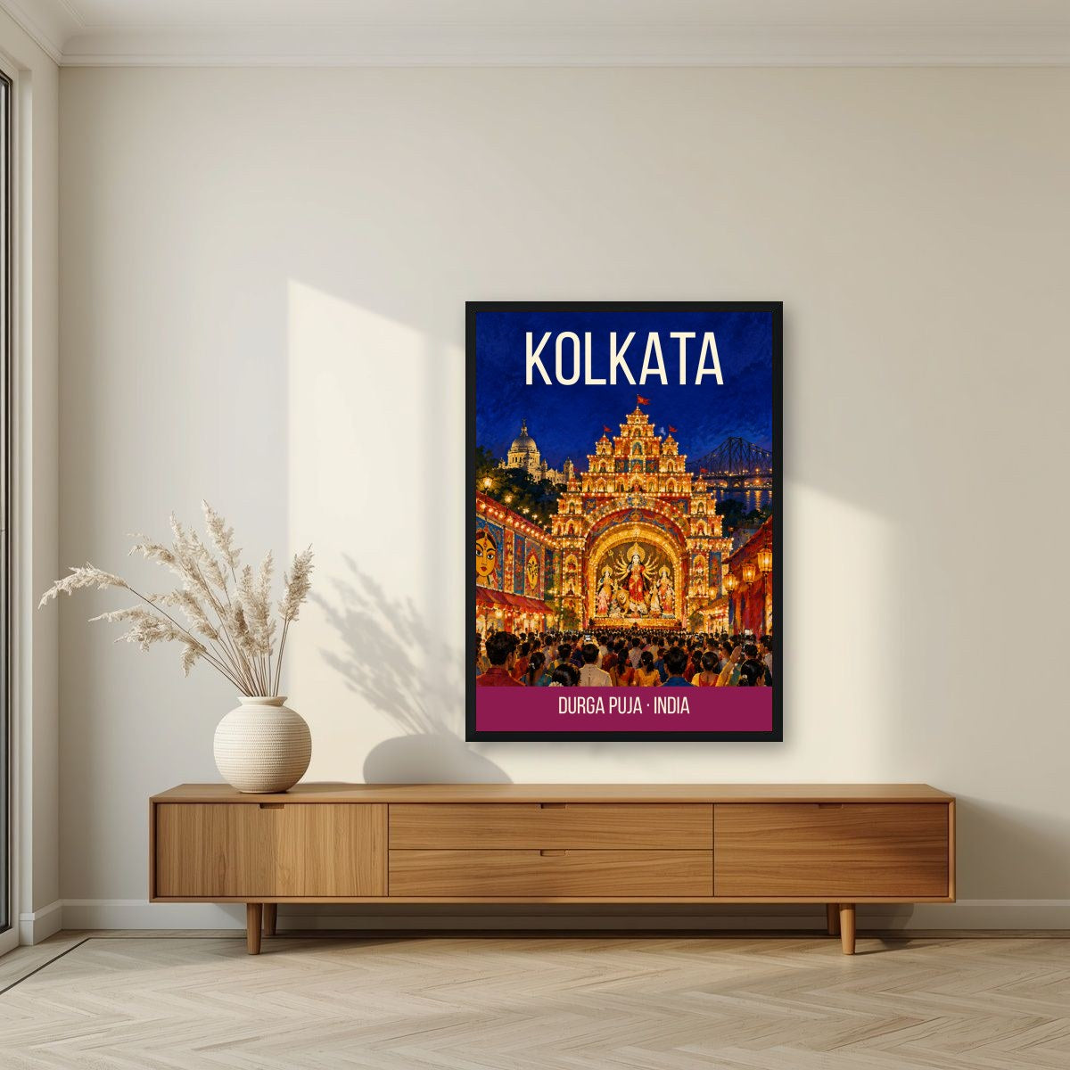 Durga Puja Kolkata art print in a black frame above a living room sideboard