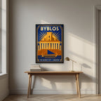 Phoenician Sail — Byblos art print, in a black frame, styled in a desk