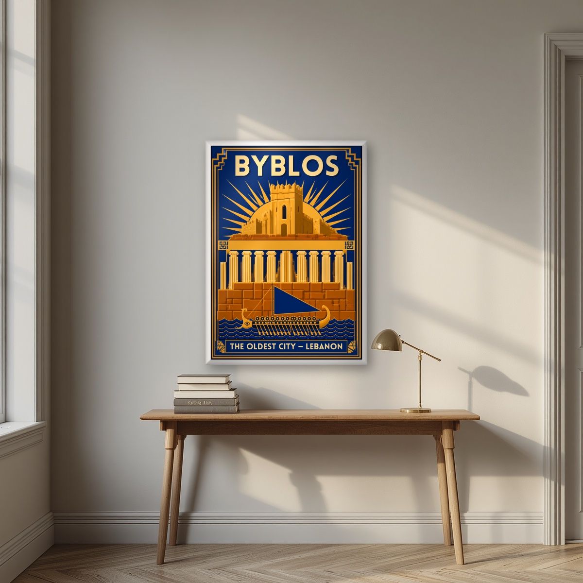 Phoenician Sail — Byblos art print, in a white frame, styled in a desk
