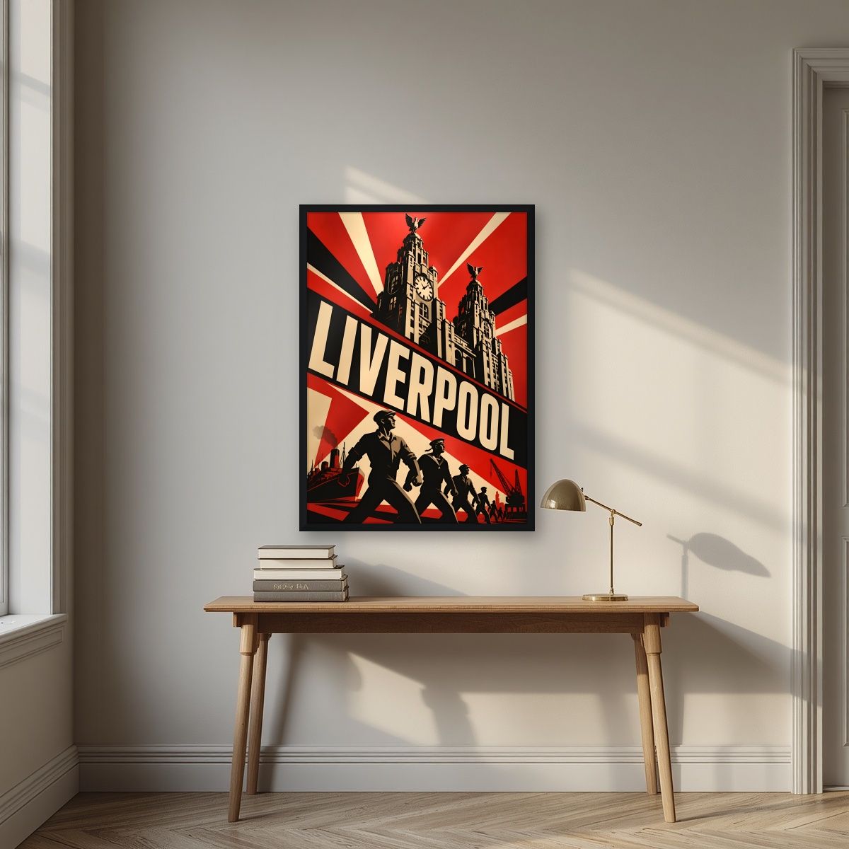 The Liver Birds — Liverpool art print, in a black frame, styled in a desk