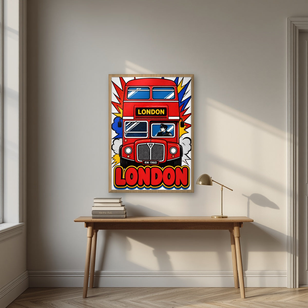 Routemaster London art print in an oak frame, above an oak writing desk