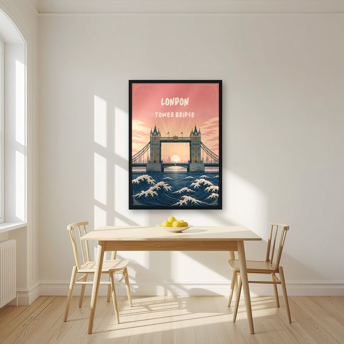 Tower Bridge London art print in a black frame, above a dining table in a bright kitchen