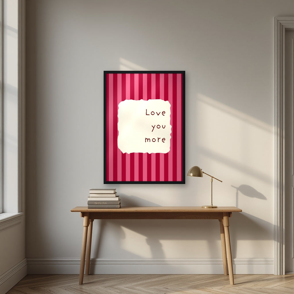 Love You More – Claret Stripe print in a black frame above a desk