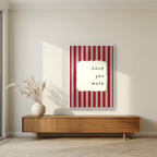 Love You More – Garden Sage print in a white frame in a living room
