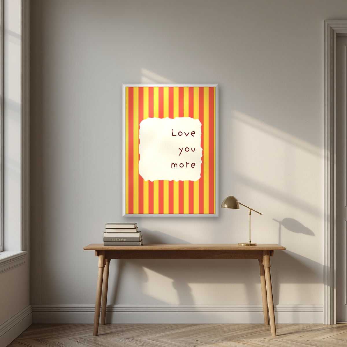 Love You More – Marmalade Stripe print in a white frame above a desk