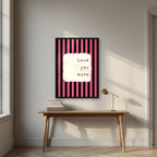 Love You More – Midnight Stripe print in a black frame above a desk
