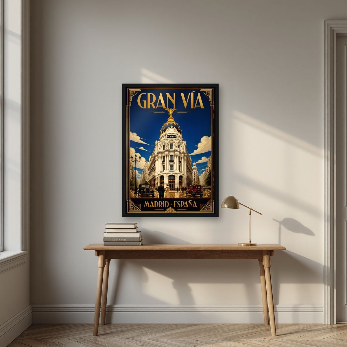 Gran Vía — Madrid art print, in a black frame, styled in a desk