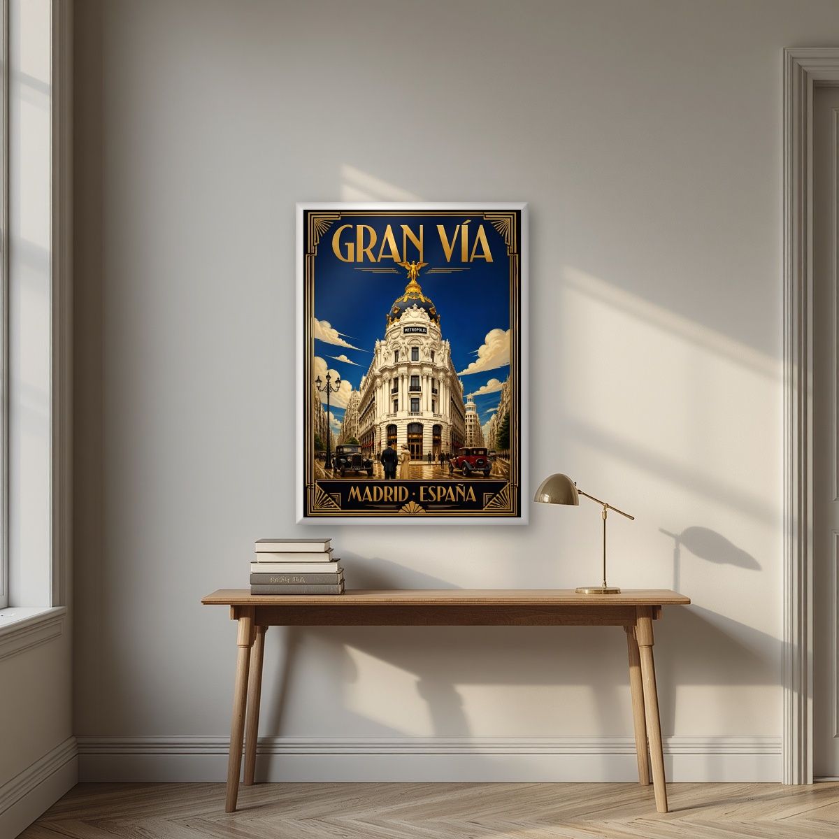 Gran Vía — Madrid art print, in a white frame, styled in a desk