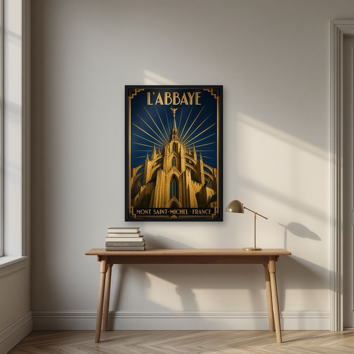L'Abbaye — Mont-Saint-Michel art print, in a black frame, styled in a desk