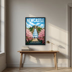 Alnwick Garden Newcastle art print in a black frame, above an oak writing desk