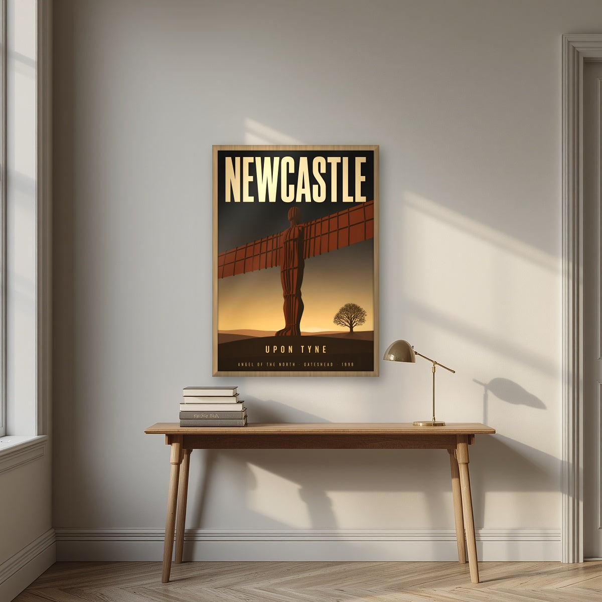 Angel of the North Newcastle art print in an oak frame, above an oak writing desk