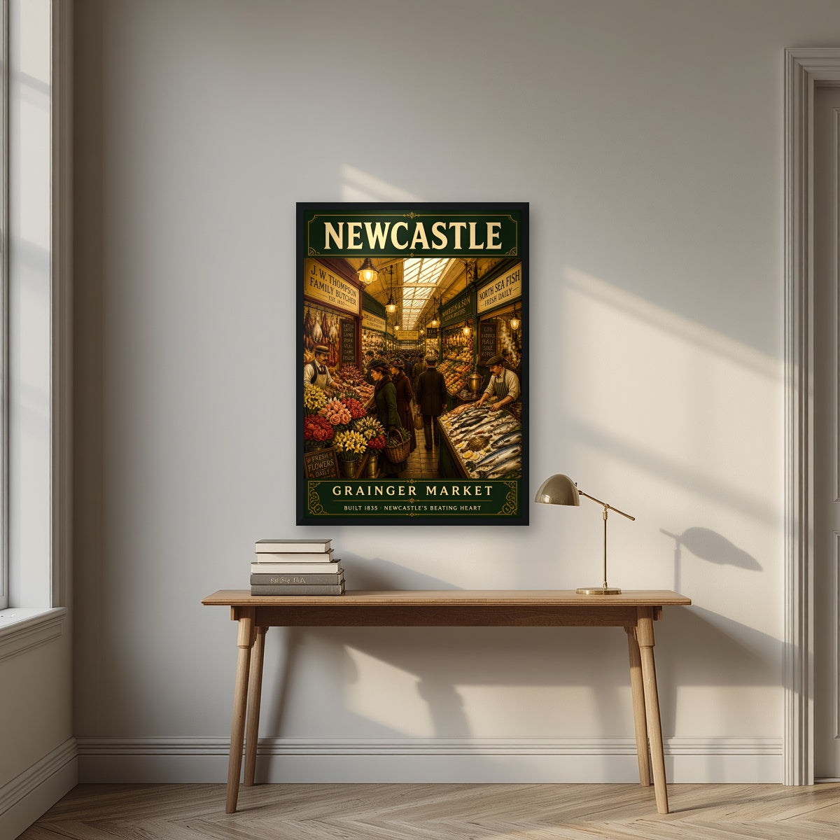 Grainger Market Newcastle art print in a black frame, above an oak writing desk