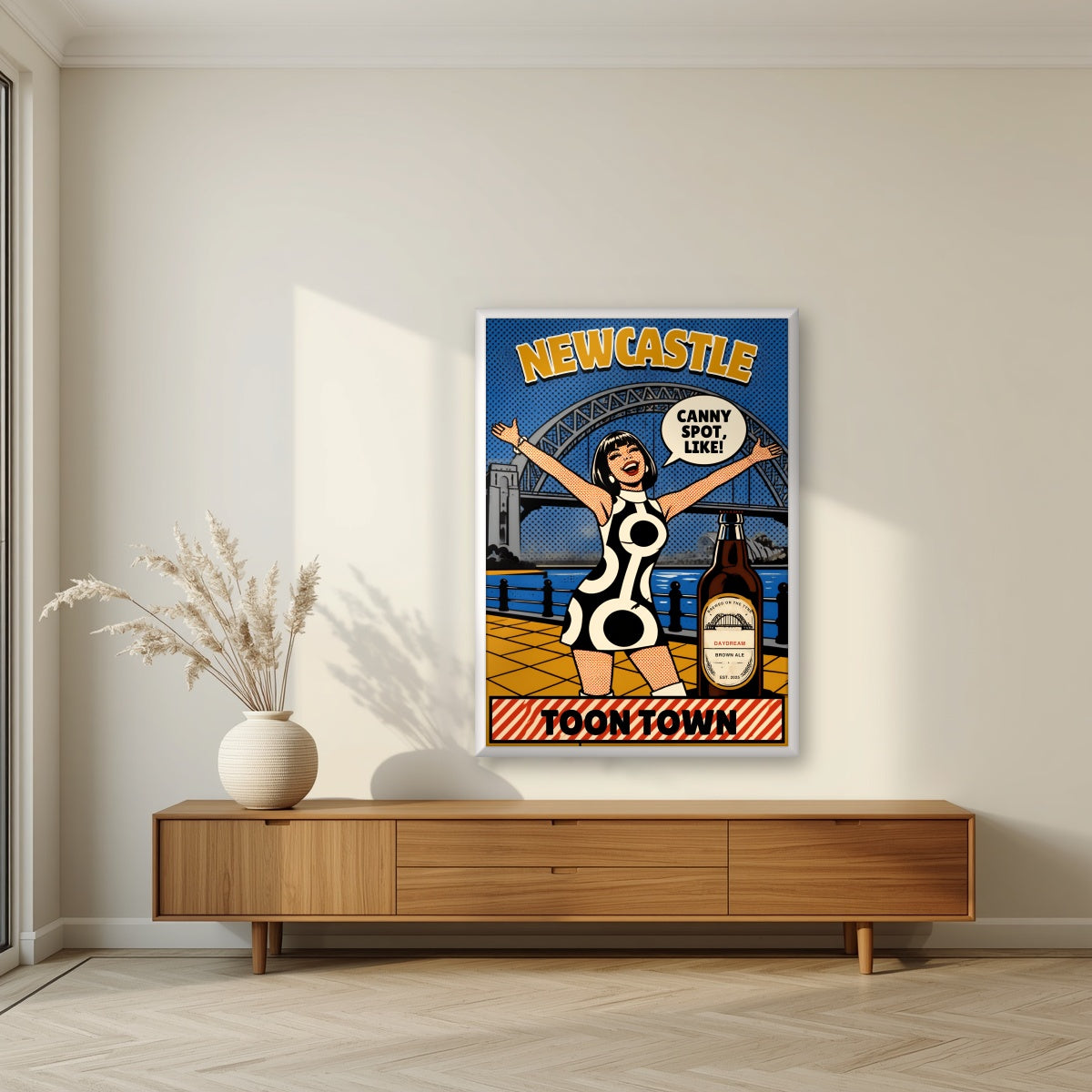 Toon Town Newcastle art print in a white frame, above a walnut sideboard in a living room