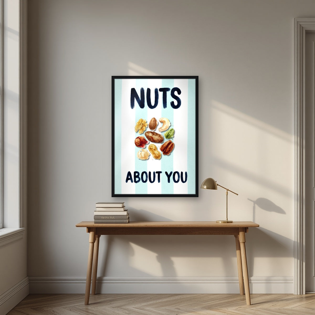 Nuts About You – Amalfi Aqua in a black frame, above an oak writing desk
