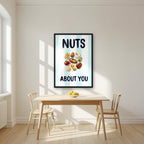 Nuts About You – Amalfi Aqua in a black frame, above a dining table in a bright kitchen
