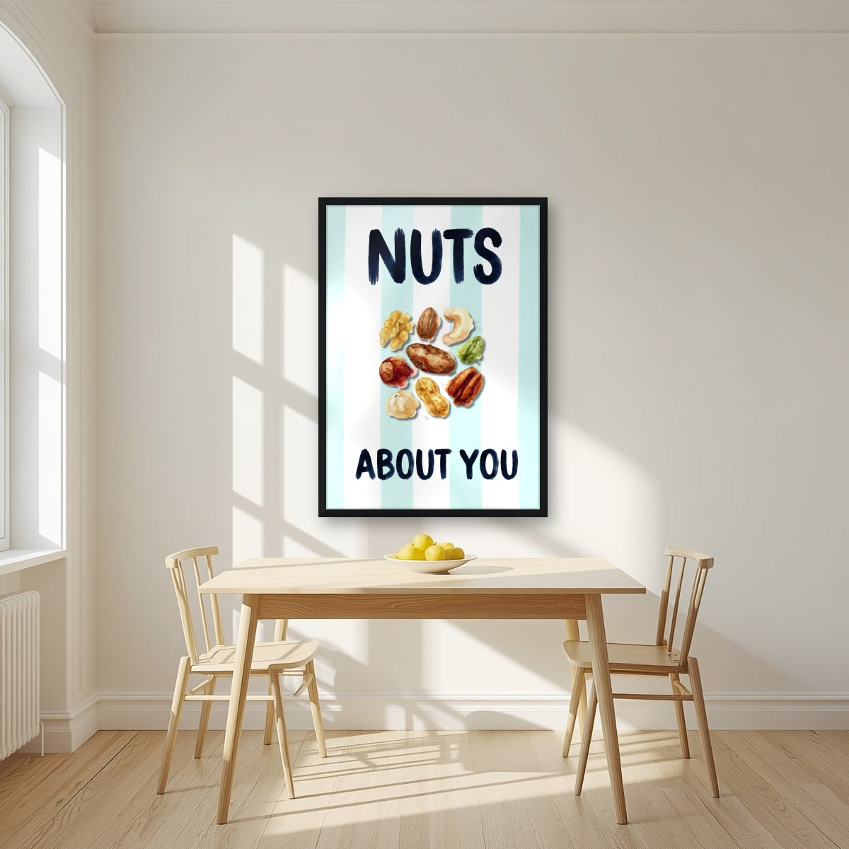 Nuts About You – Amalfi Aqua in a black frame, above a dining table in a bright kitchen