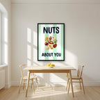 Nuts About You – Cabana Green in a black frame, above a dining table in a bright kitchen