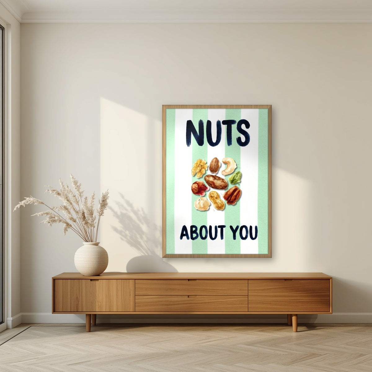 Nuts About You – Cabana Green in an oak frame, above a walnut sideboard in a living room