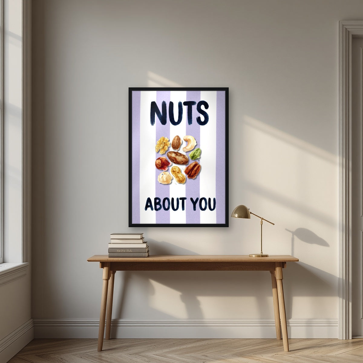 Nuts About You – Capri Violet in a black frame, above an oak writing desk