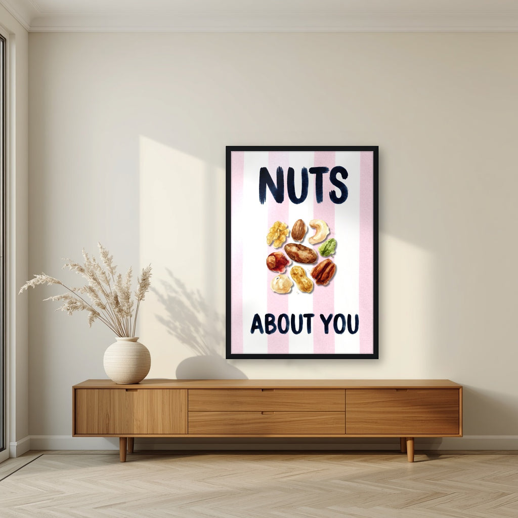 Nuts About You – Positano Pink in a black frame, above a walnut sideboard in a living room