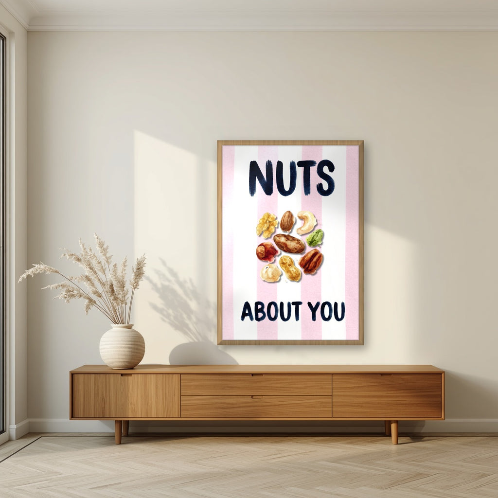 Nuts About You – Positano Pink in an oak frame, above a walnut sideboard in a living room
