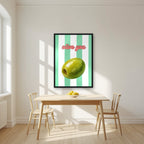 Olive You – Cabana Green in a black frame, above a dining table in a bright kitchen