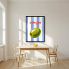 Olive You – Capri Violet in a black frame, above a dining table in a bright kitchen